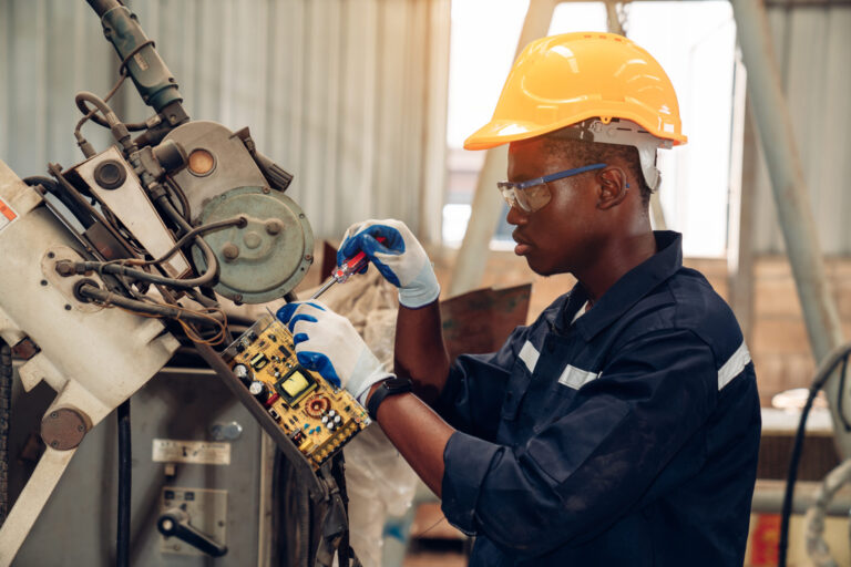 factory-technician-repairing-electronic-circuit-bo-2026-03-09-03-24-42-utc-scaled